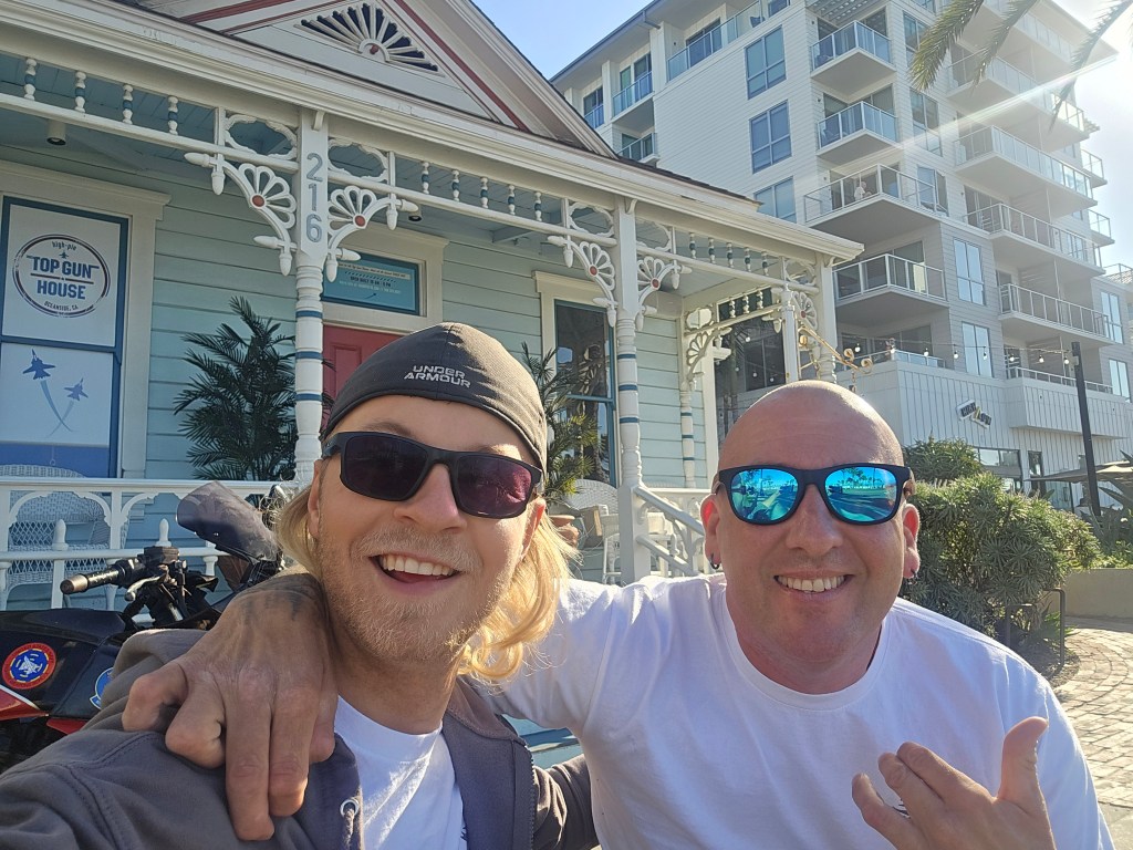 2 friends outside top gun house